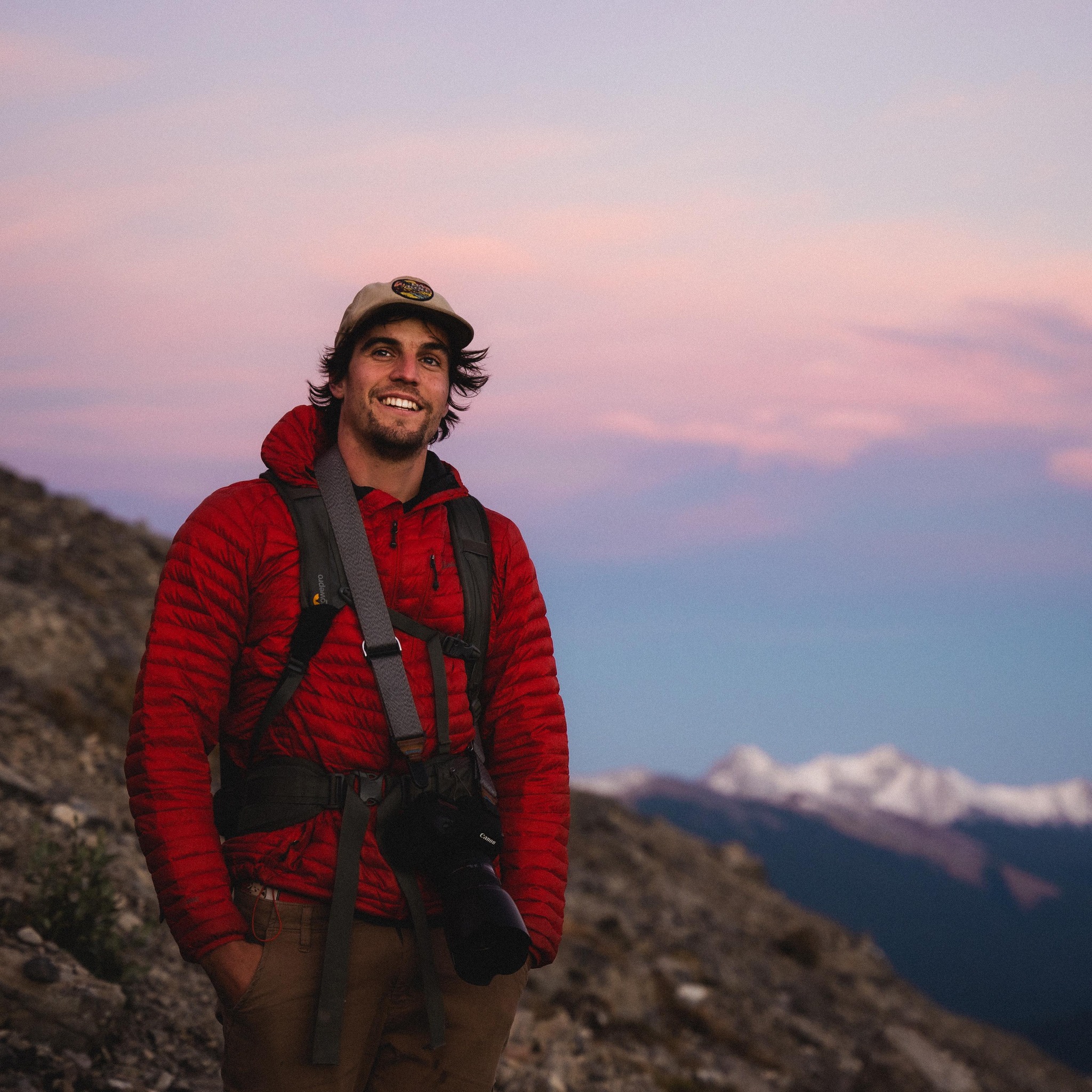 Jeremy Allen holding a camera in the mountains of Squamish, British Columbia