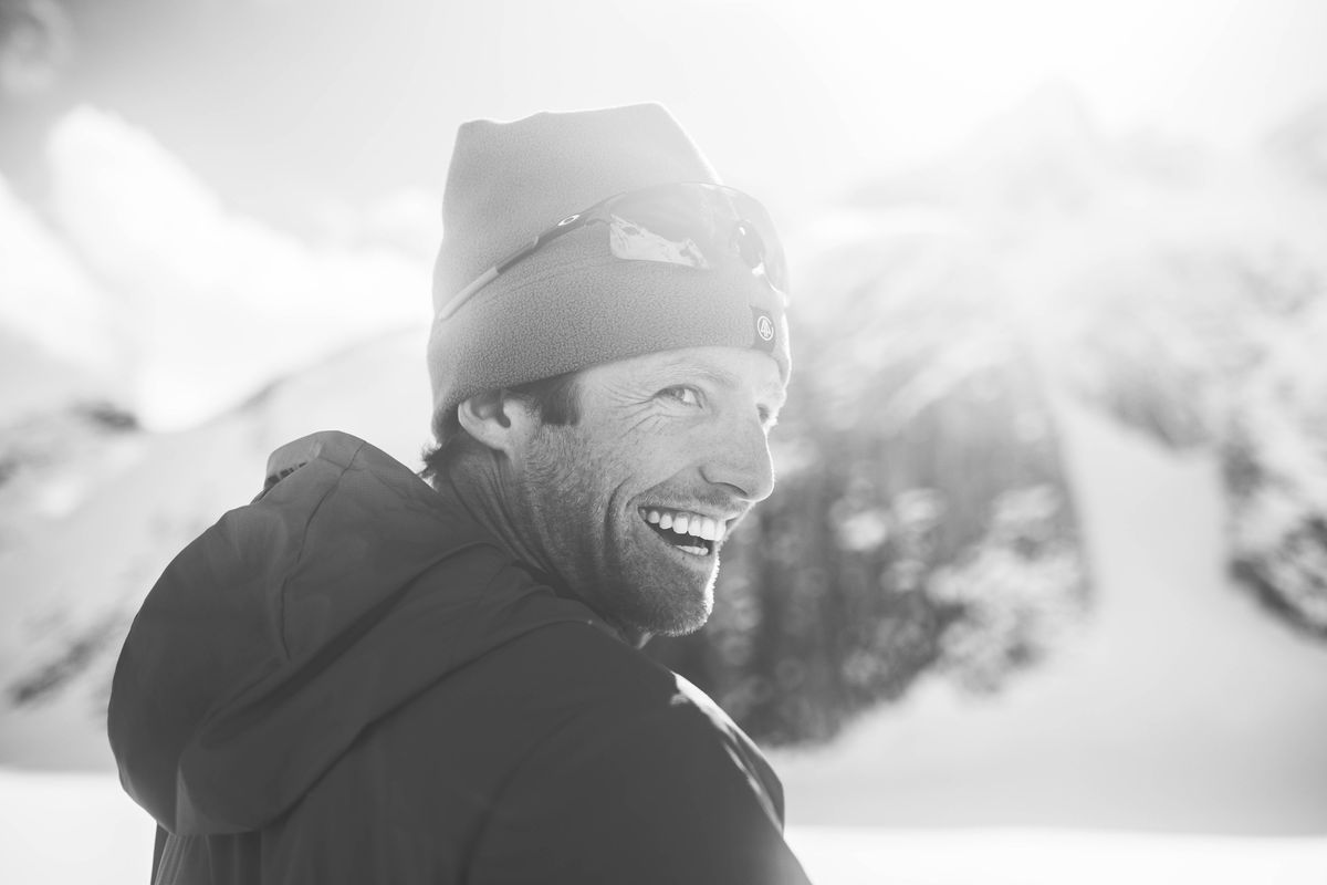 Black and white portrait of a smiling ski guide in the alpine