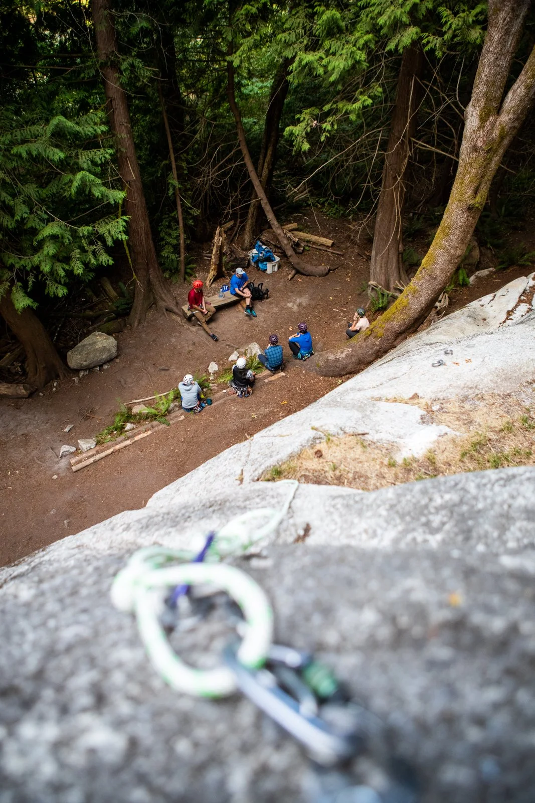 Sunset light on rock climber high on Squamish bluffs