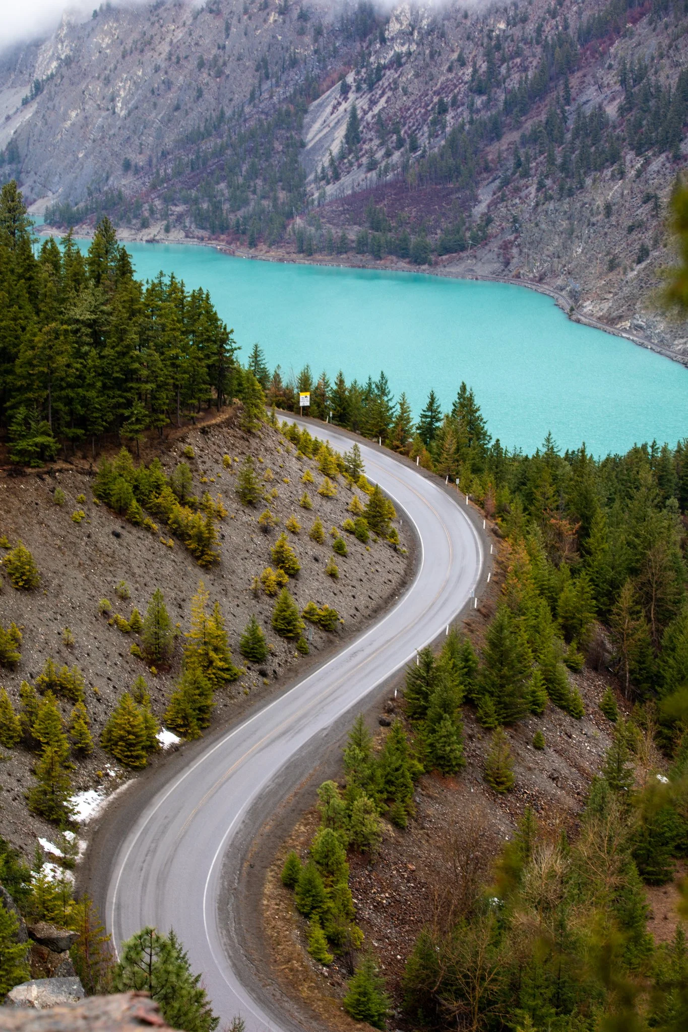 Cyclist riding through scenic British Columbia landscape for Canadian Cycling Magazine