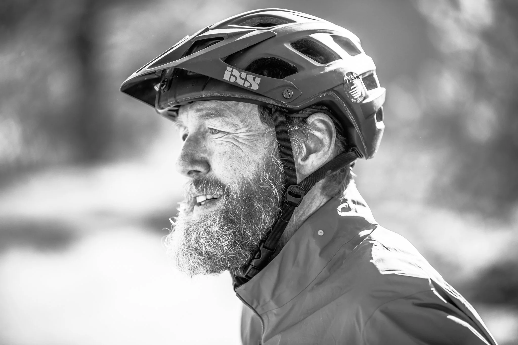 Cyclist crossing finish line at golden hour for editorial feature