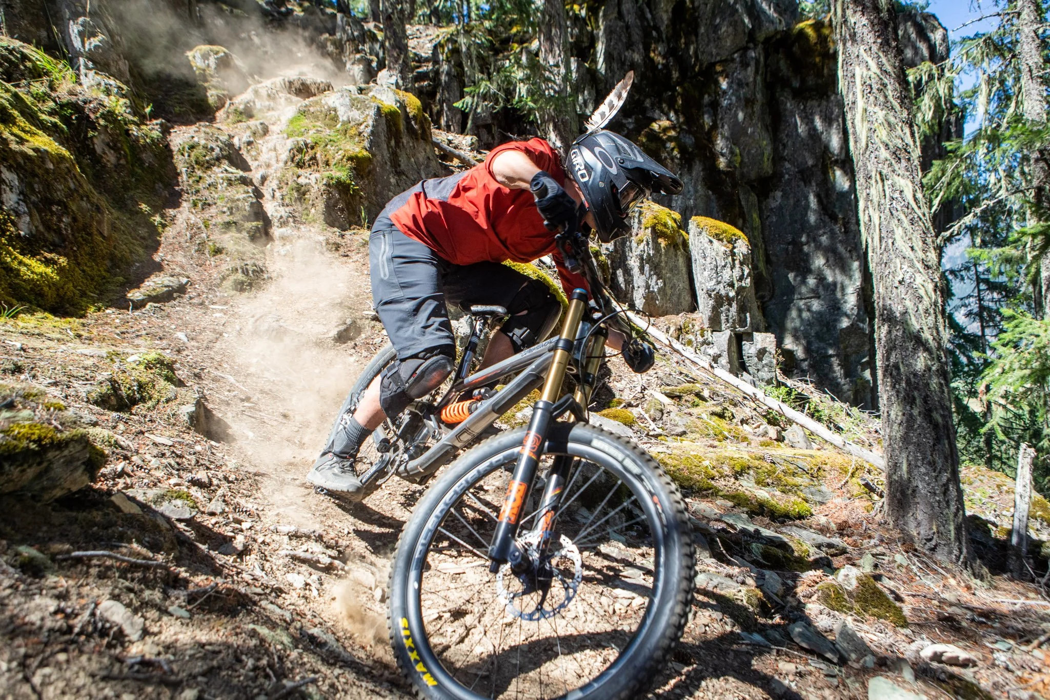 Close-up of rider navigating rocky trail section during Deep Summer