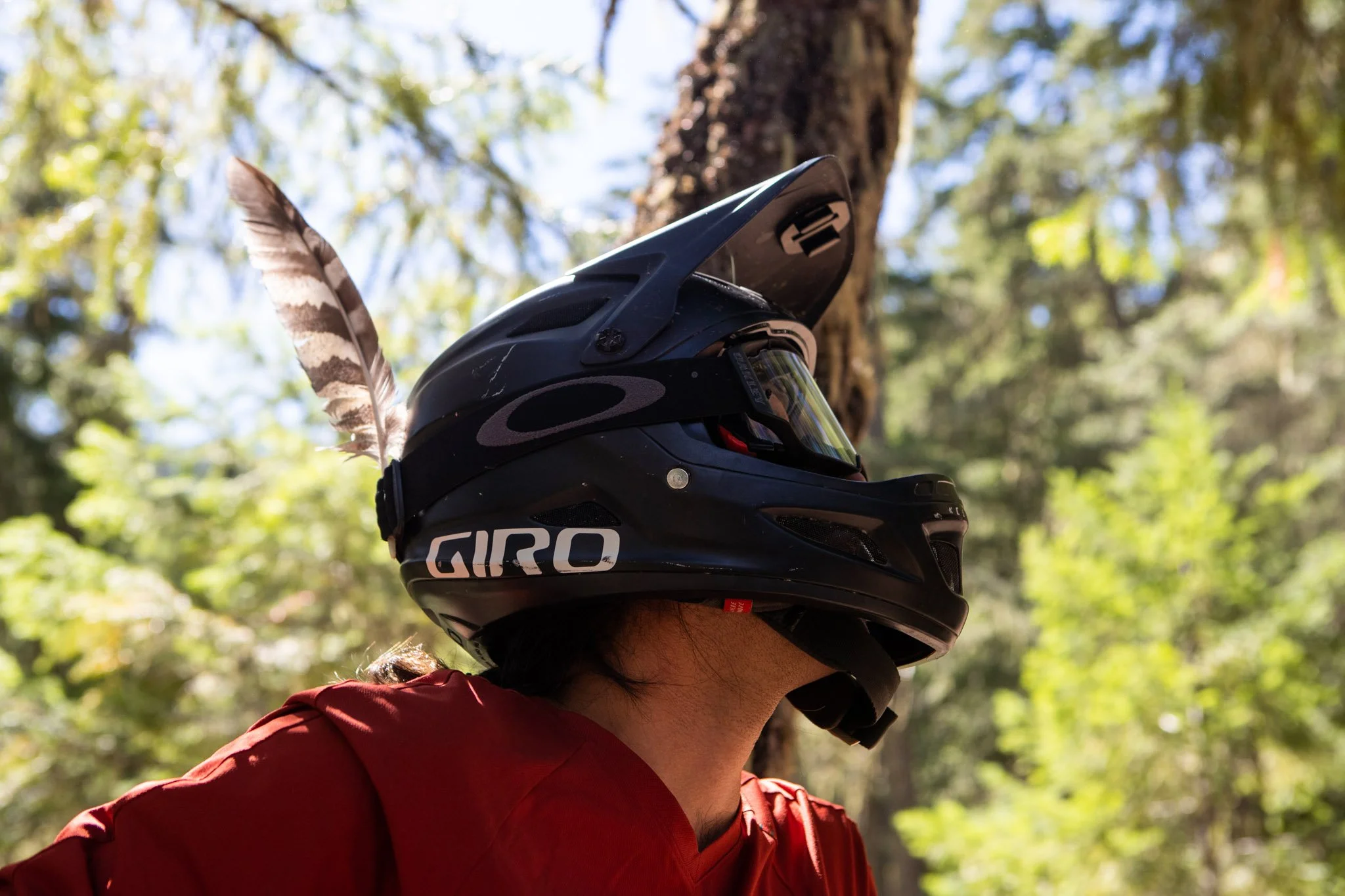 Golden hour silhouette of rider on exposed mountain ridge