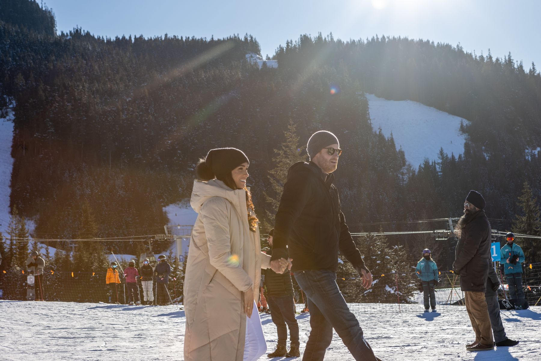 The Duke and Duchess of Sussex walking together in the snow in Whistler
