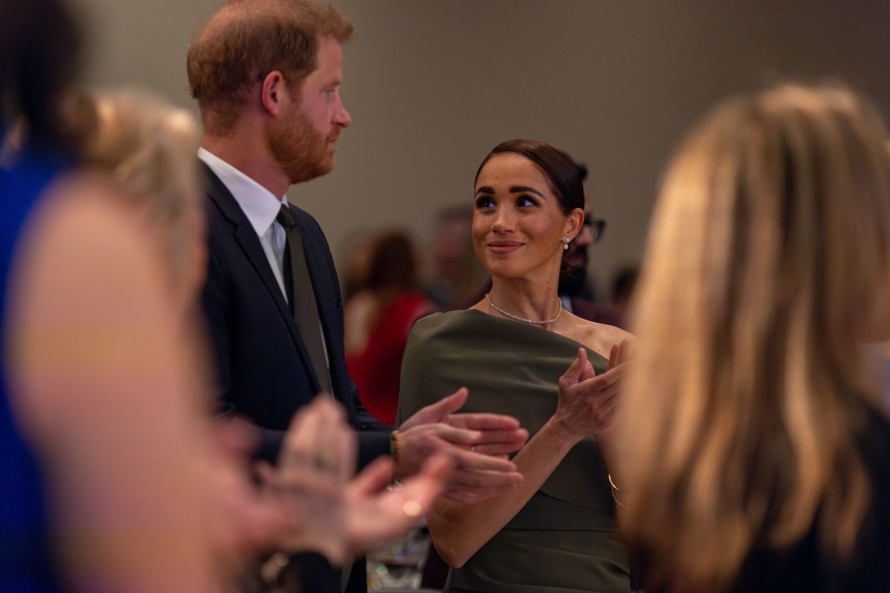 The Duke and Duchess of Sussex in conversation at an evening reception