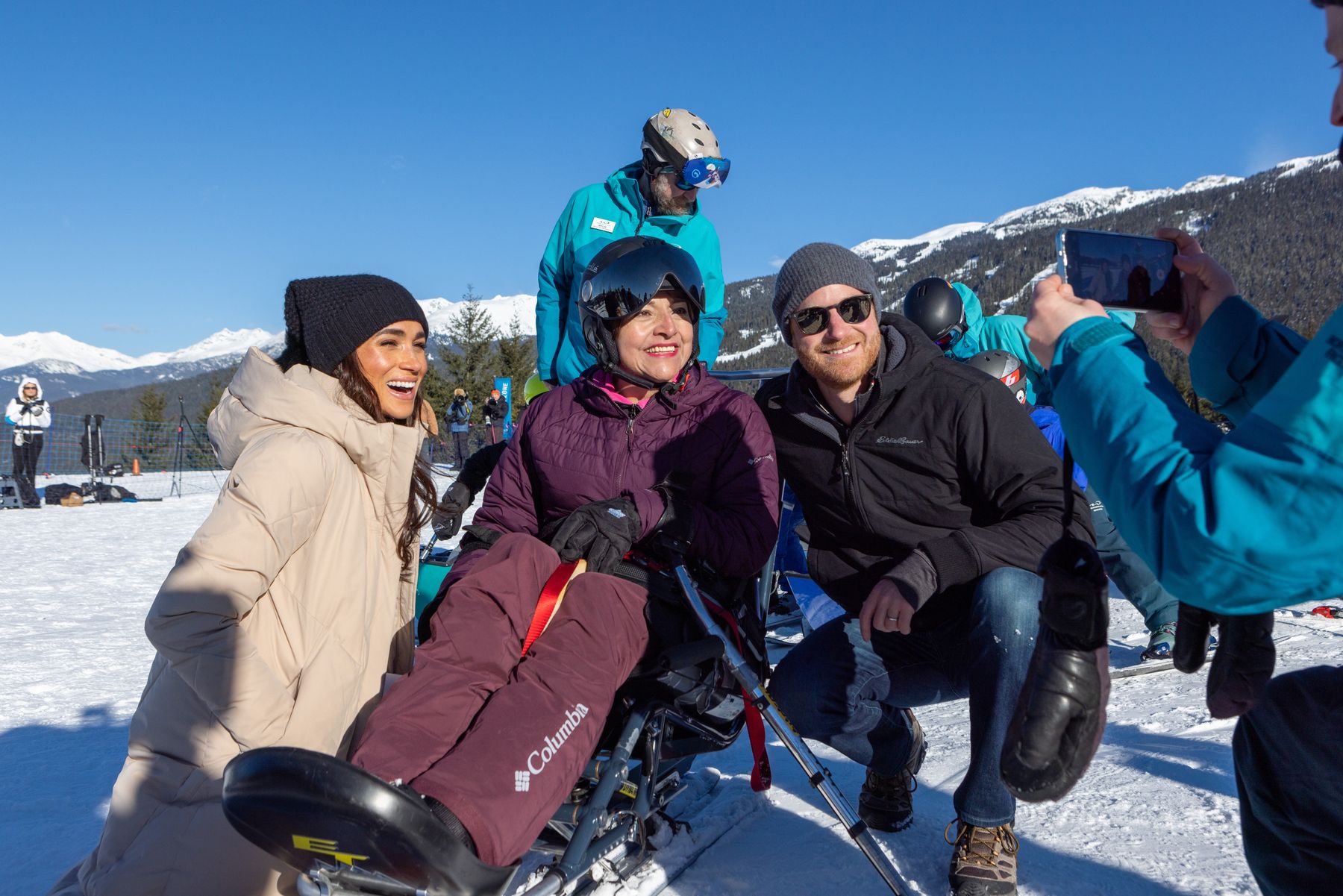 The Duchess of Sussex with an adaptive sit-ski athlete in Whistler