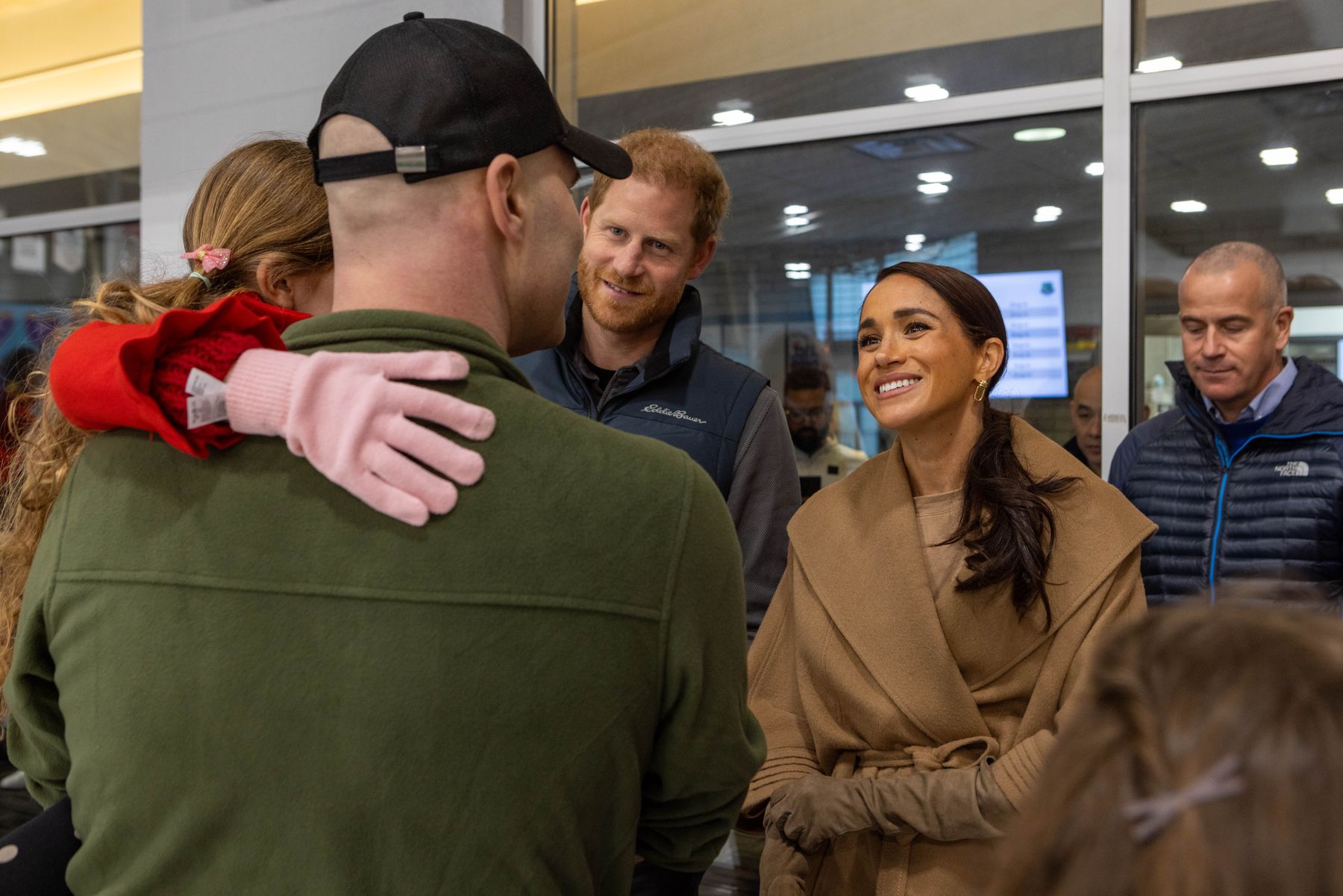 Prince Harry embracing an Invictus competitor in Whistler