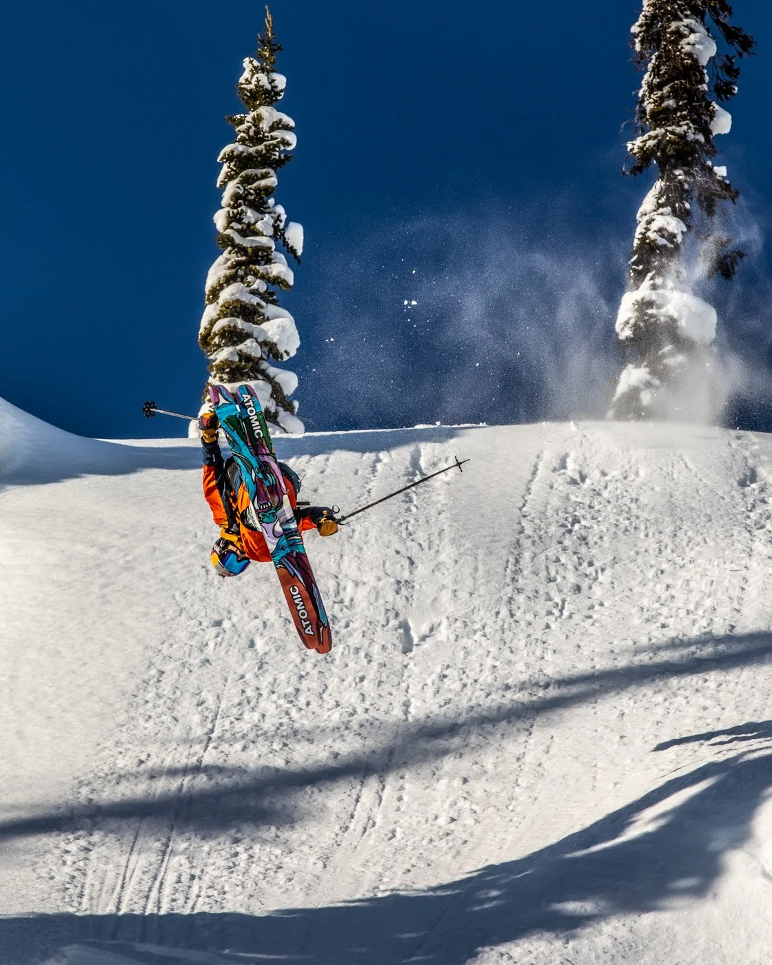 Close-up of skier navigating through tight tree run