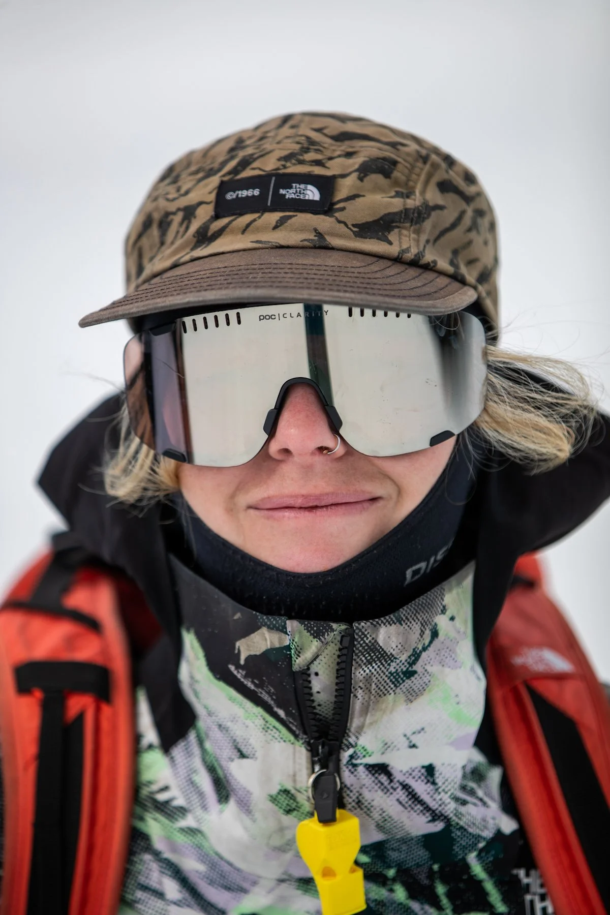 Portrait of Myia Antone against snowy mountain backdrop at sunrise
