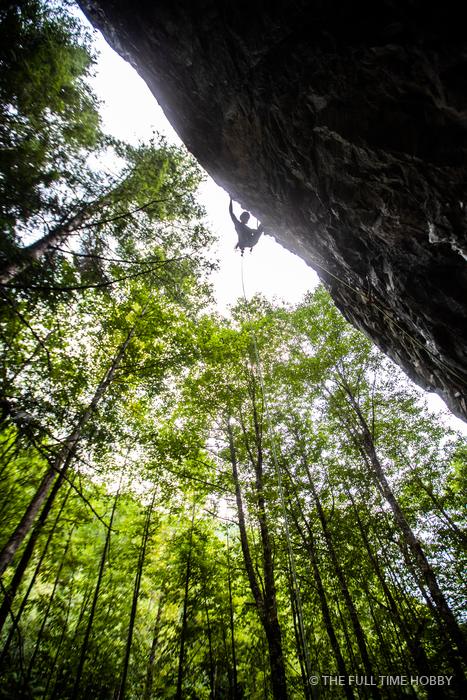 Climber Under a Mossy Roof, Squamish, BC