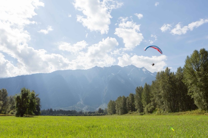 Paraglider Over the Valley &mdash; stock photo by Jeremy Allen