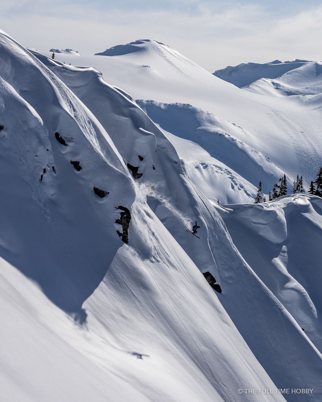 Skier on Steep Spines, Mike Wiegele Helicopter Skiing, Blue River, BC