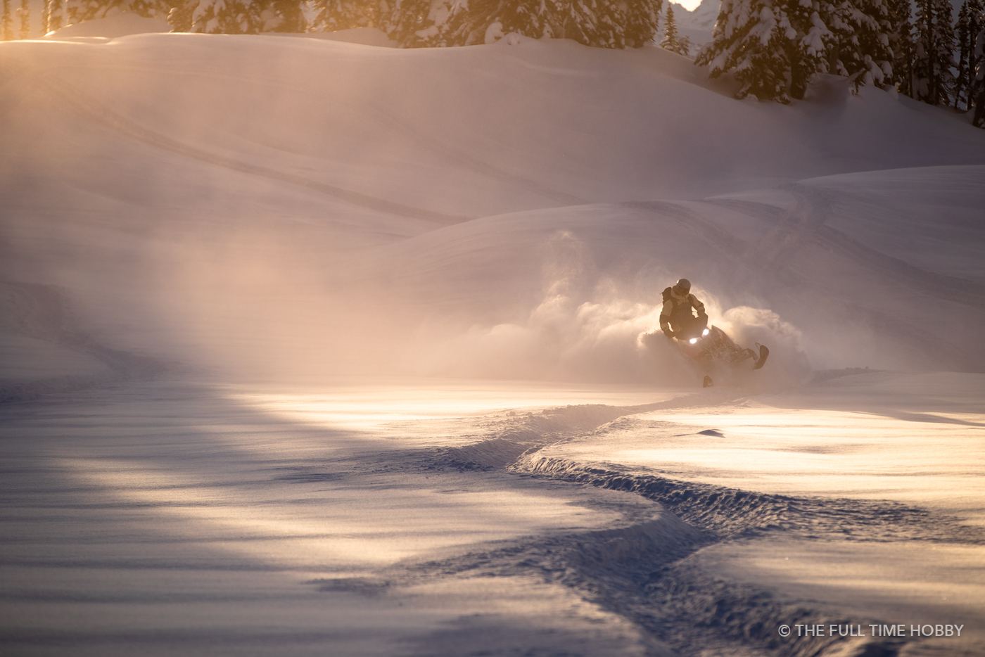 Snowmobile in Golden Light, Whistler area, BC